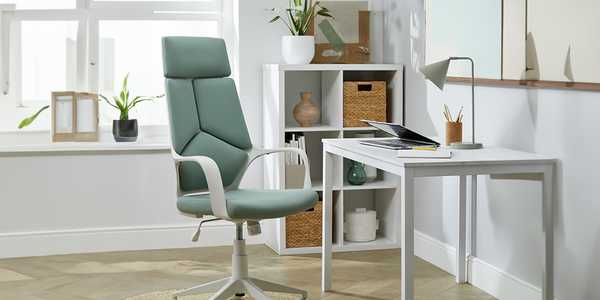 An ergonomical chair and desk in a home office.